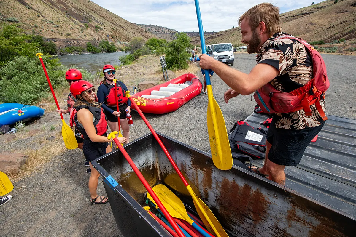 Collecting paddles after finishing the Big Eddy