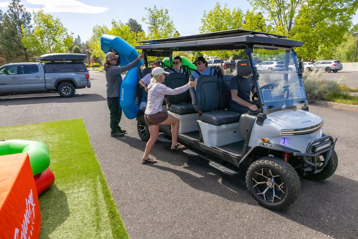 Loading Sun Country Tours' electric golf cart shuttles for direct rides to the river float